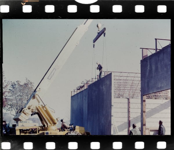 Vintage Slide: Crane holding wall section